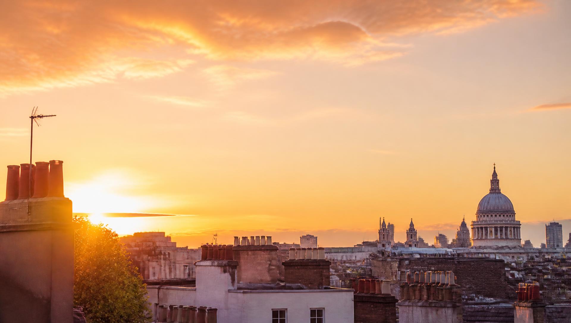 Sunrise over London rooftops and chimney pots